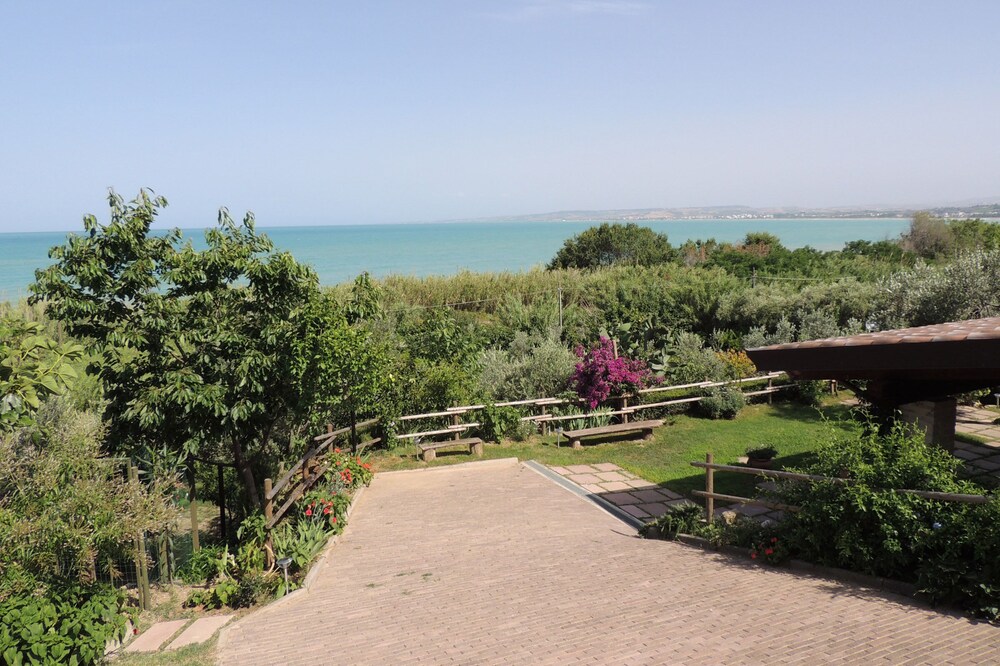 Private house with porch and garden, just steps from the beach
