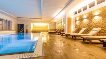 Indoor pool, a heated pool, open 9:00 AM to 9:00 PM, pool loungers