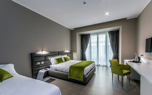 A modern hotel room with a large bed, bedside tables, a desk, and a chair. - Hotel Matilde - Lifestyle Hotel (Naples)