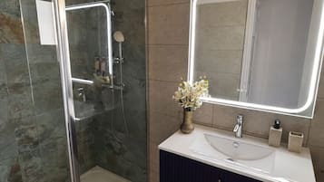 Bathtub, hair dryer, towels, soap