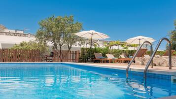 Outdoor pool, open 10:00 AM to 8:00 PM, pool loungers