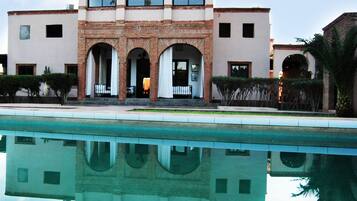 Outdoor pool, pool umbrellas, sun loungers