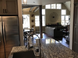 Enjoy a comfortable stay in this inviting space with a modern kitchen, dining area, and cozy living space.
