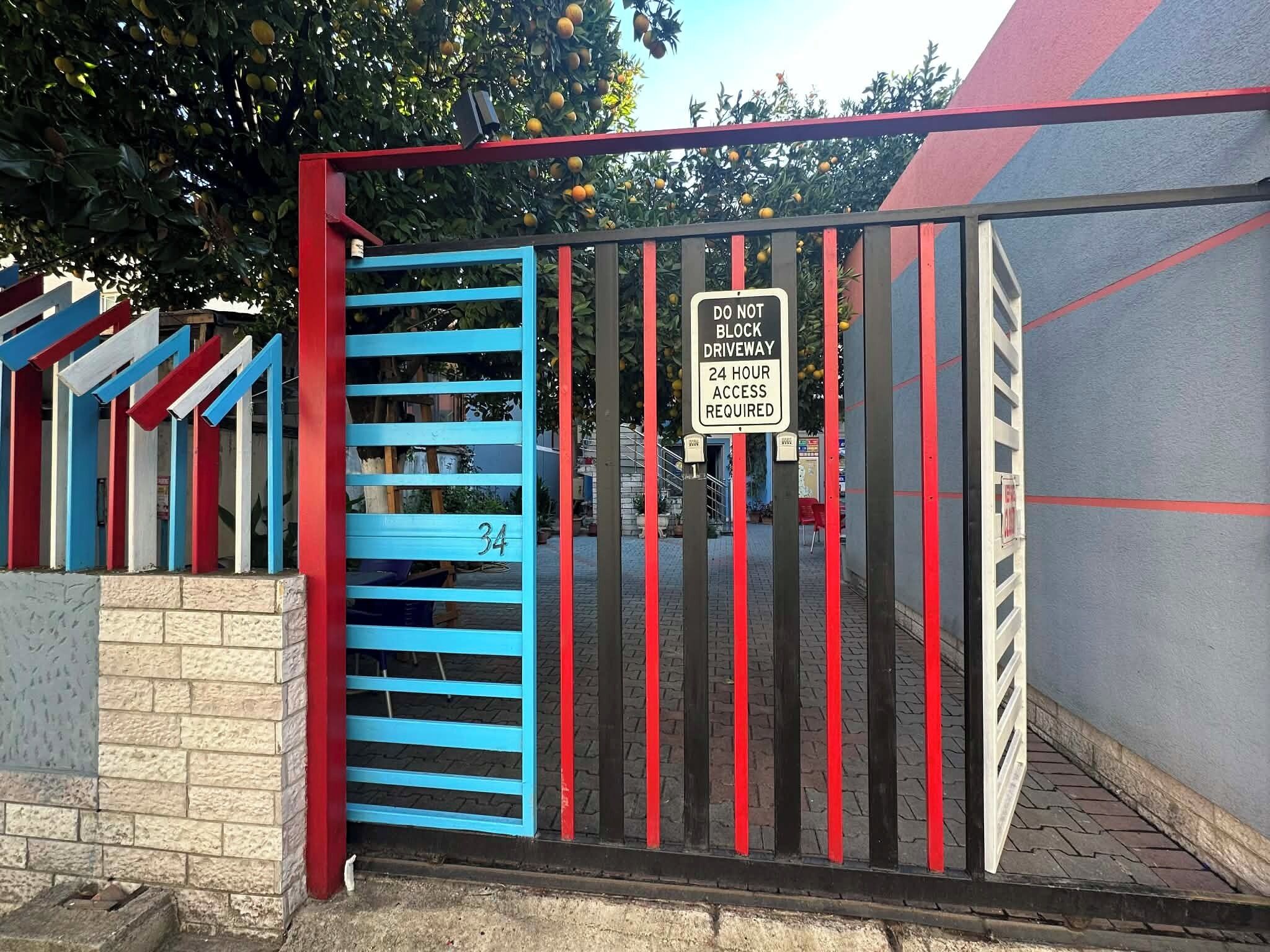 A gated entrance with a sign indicating 24-hour access required.