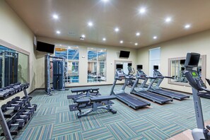 A gym with treadmills, weight machines, and dumbbells. - Holiday Inn Amarillo East by IHG (Amarillo)