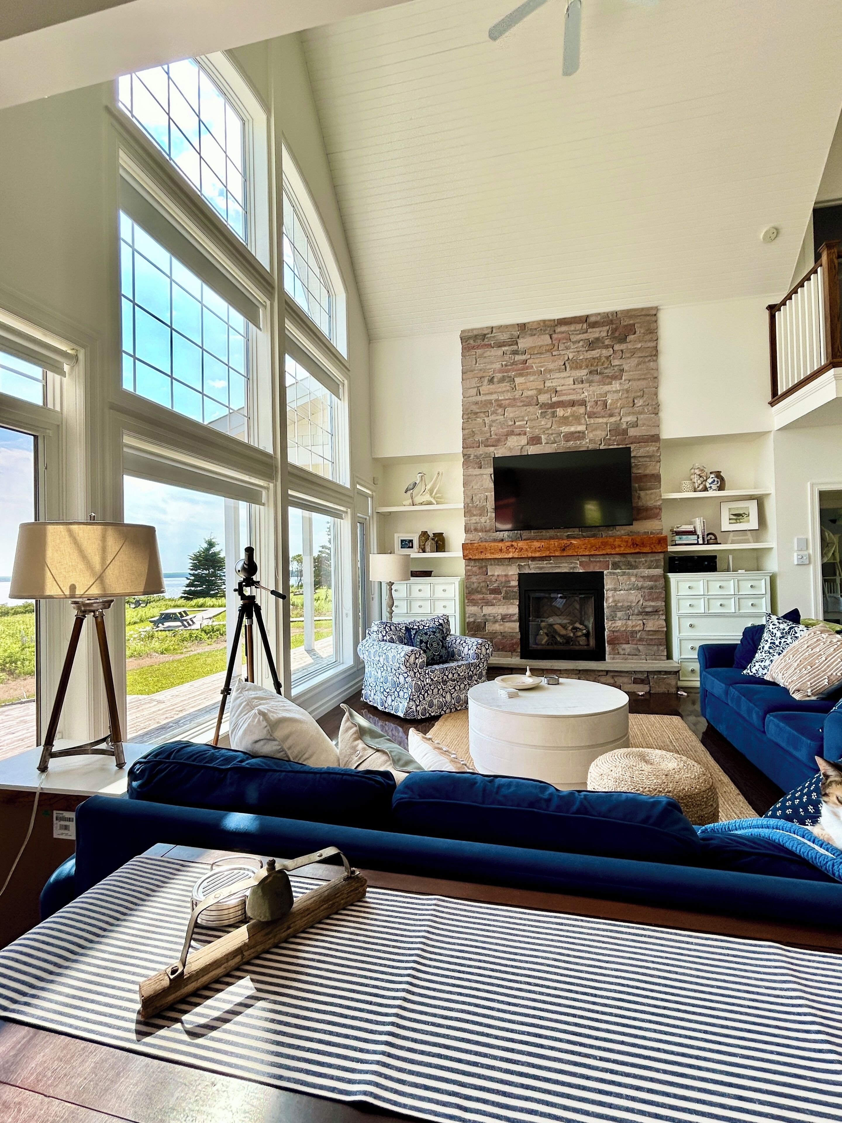 LIVINGROOM:Beautiful open concept living area. 66’ of windows