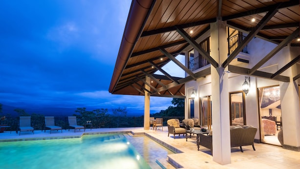 A covered outdoor area with a pool, seating, and a view of the sky. - Platinum - A New level of Luxury, with 360 degree views & unmatched quality (Quepos)
