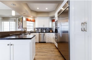 Fridge, microwave, oven, stovetop - Full Beach Front Home - 2002 W. Oceanfront, Full Beach Front Home - 2002 W. Oceanfront (Newport Beach)