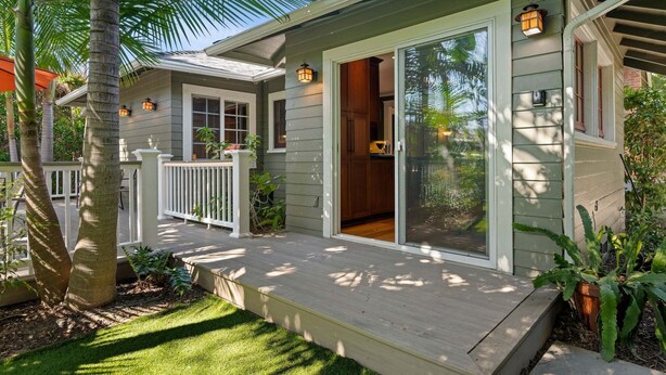 A house with a covered porch, a sliding glass door entrance, and a small deck area. - Charming Home w/ Private, Enclosed Yard, Easily Accessible to All of SB! (Santa Barbara)