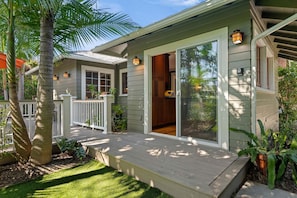 A house with a covered porch, a sliding glass door entrance, and a small deck area. - Charming Home w/ Private, Enclosed Yard, Easily Accessible to All of SB! (Santa Barbara)