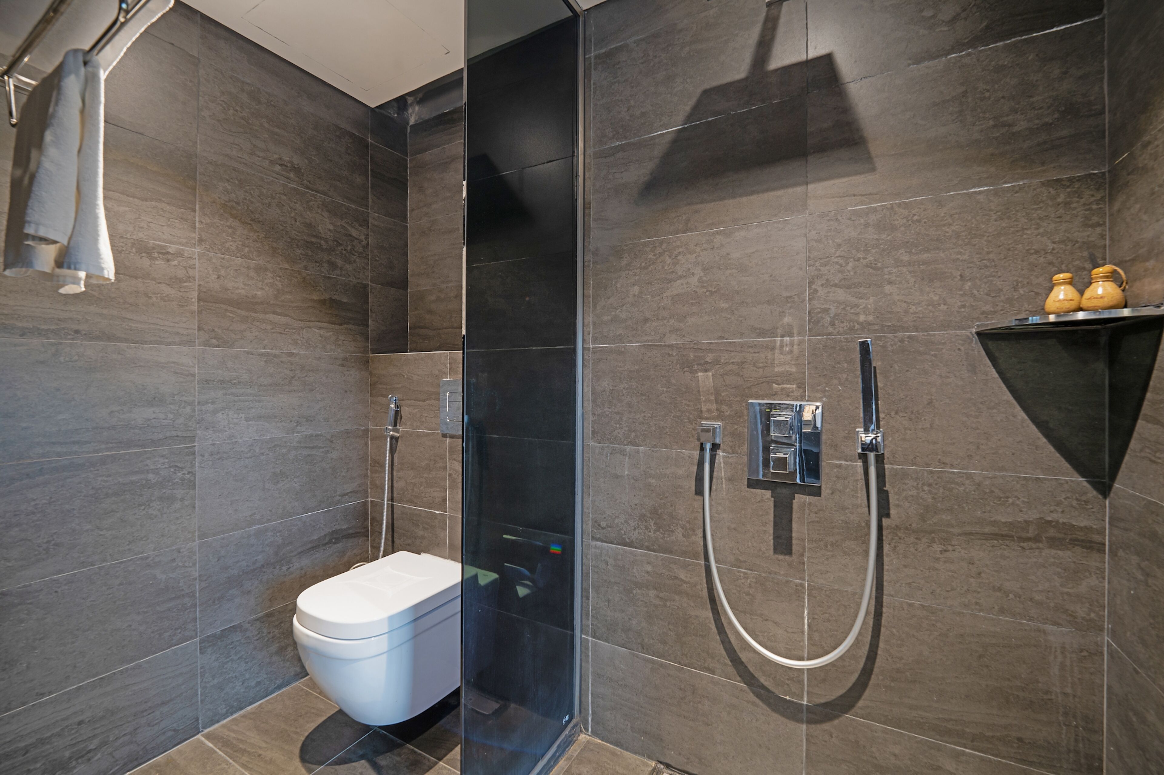 designer toiletries, hair dryer, bathrobes, slippers