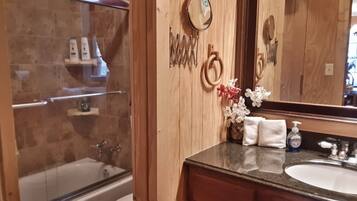 Combined shower/bathtub, hair dryer, towels, soap