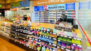 A Circle K convenience store with a variety of snacks, beverages, and household items on display. - Blitz Hotel Batam Centre (Batam)