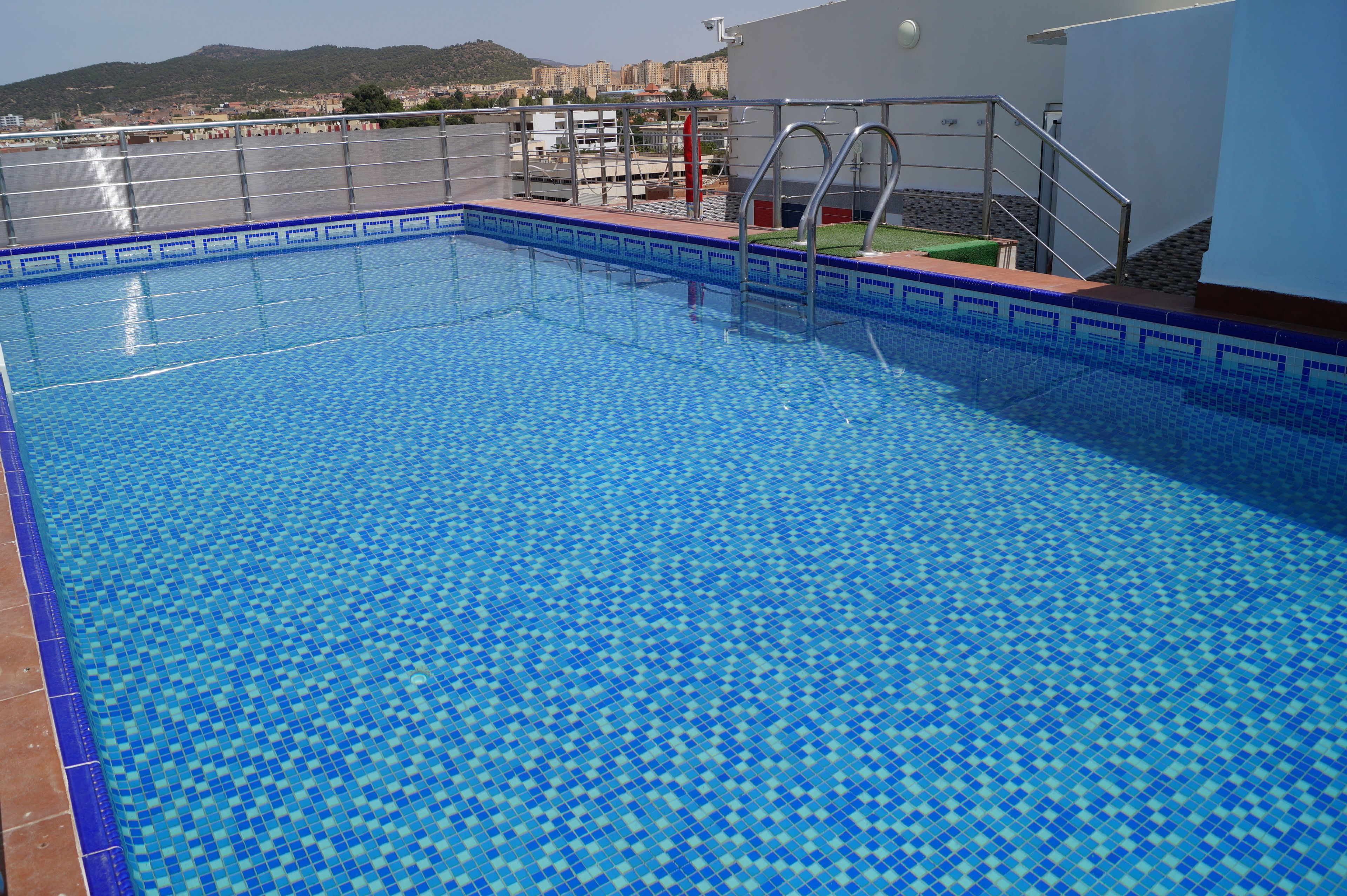 seasonal outdoor pool, pool umbrellas, pool loungers