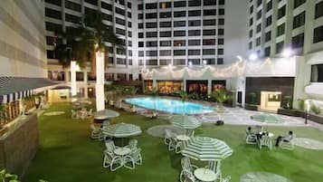 Outdoor pool, open 8:00 AM to 9:00 PM, pool umbrellas