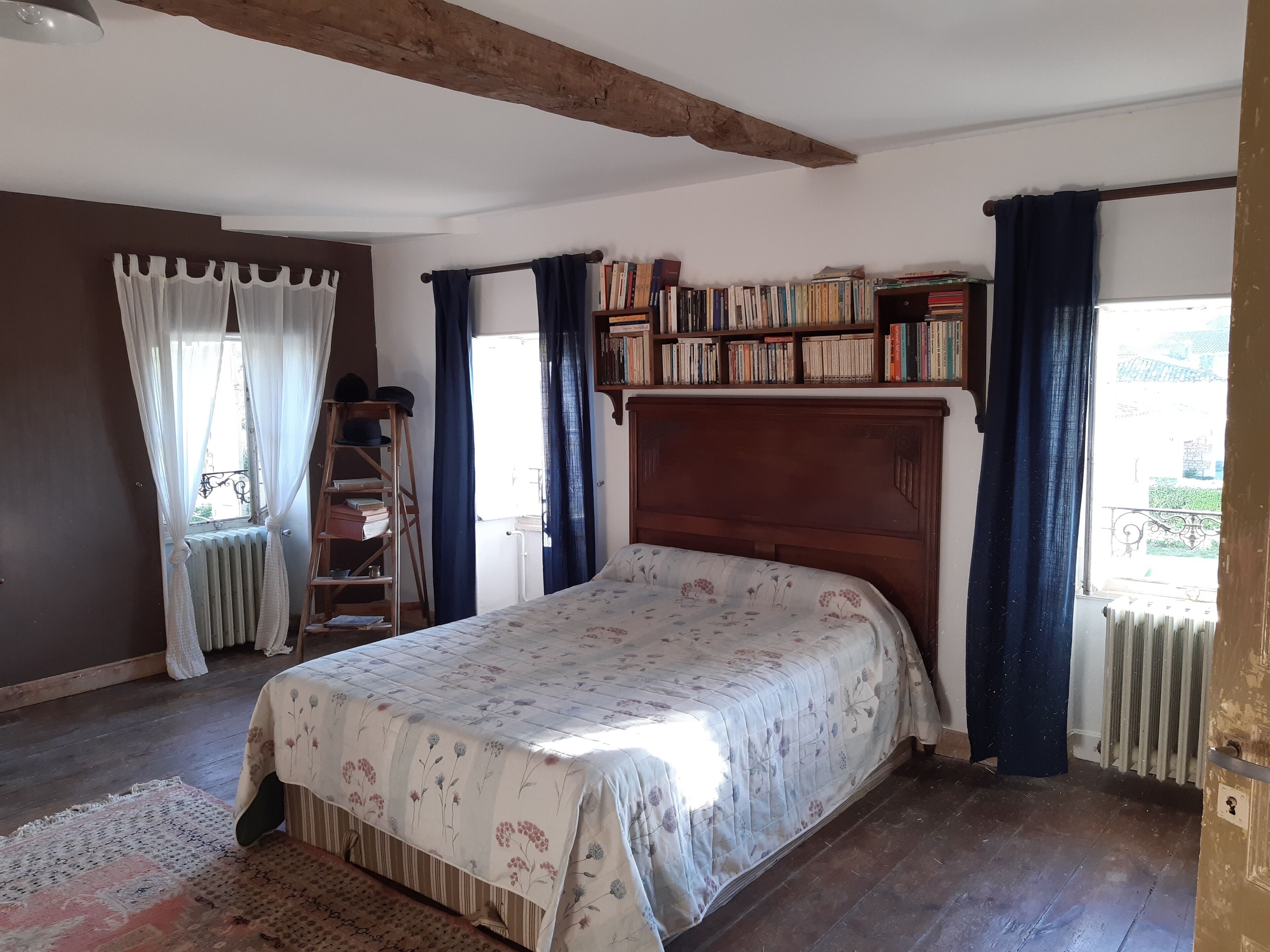 Large freestone house surrounded by large green spaces