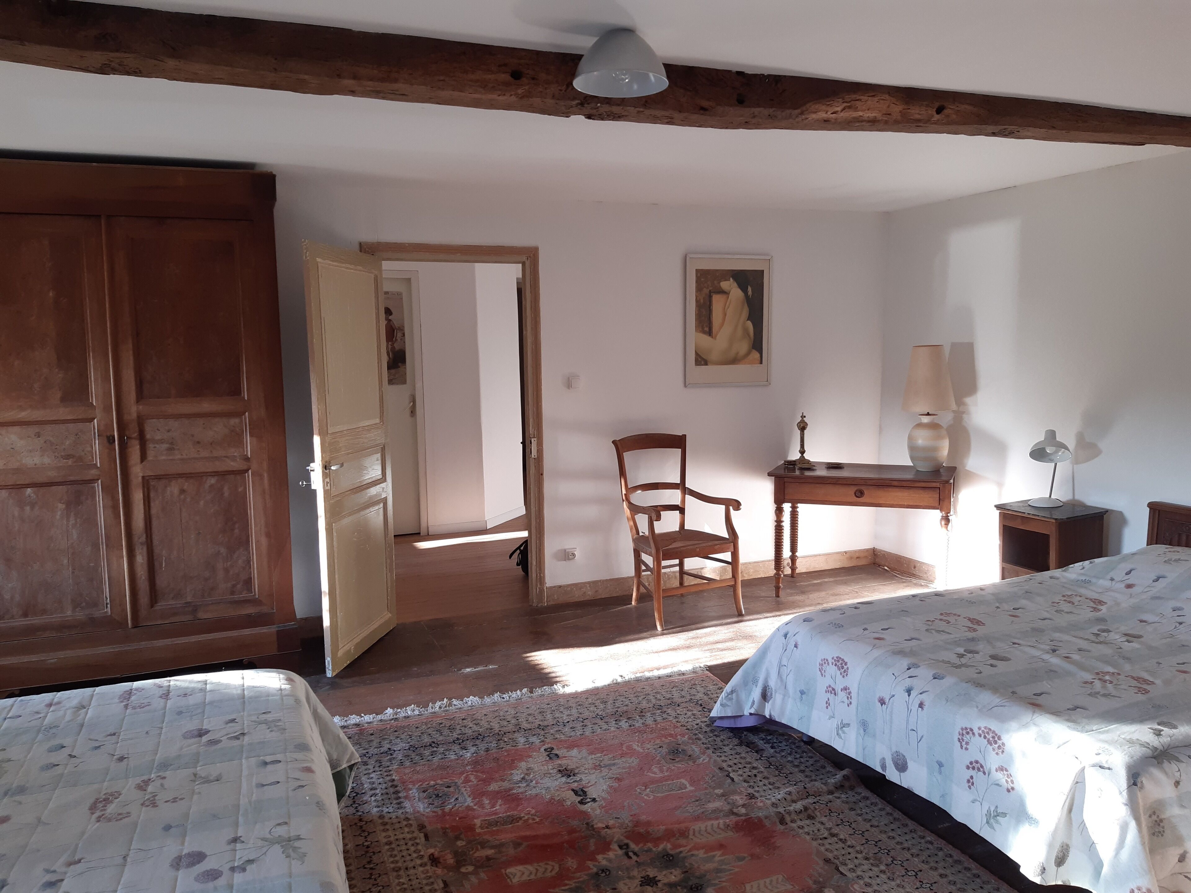 Large freestone house surrounded by large green spaces