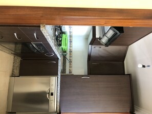 Microwave, dishwasher, coffee/tea maker, cookware/dishes/utensils