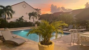 A pool area with lounge chairs and a potted plant. - 'Palm View', West Coast 3 bd/3.5br villa with Private Pool walk to beach/bars  (St James)