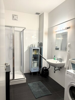 Shower, hair dryer, towels, soap