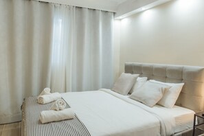 Departamento de lujo, 2 habitaciones | Tabla de planchar con plancha, wifi gratis y ropa de cama 