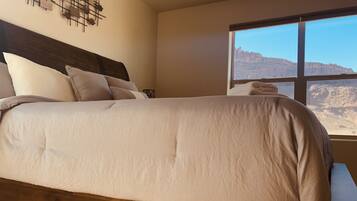 2 bedrooms, memory-foam beds, iron/ironing board, travel cot