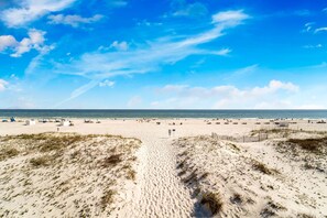 On the beach, sun-loungers, beach towels