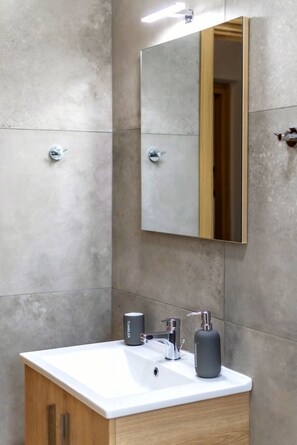 Bathtub, hair dryer, towels, soap
