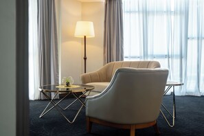 Executive Suite, 1 King Bed | Living area | 32-cm LCD TV with premium channels, TV