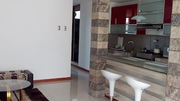 Apartment, 2 Bedrooms, Non Smoking | Living area | 32-inch Smart TV with cable channels, TV