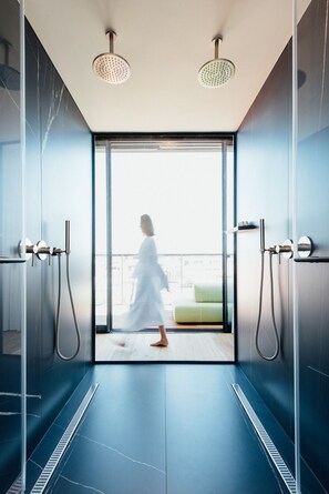 Deep-soaking bathtub, designer toiletries, hair dryer, bathrobes