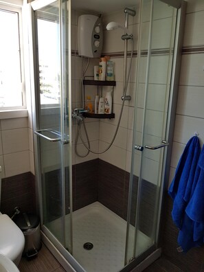 Shower, hair dryer, towels, soap