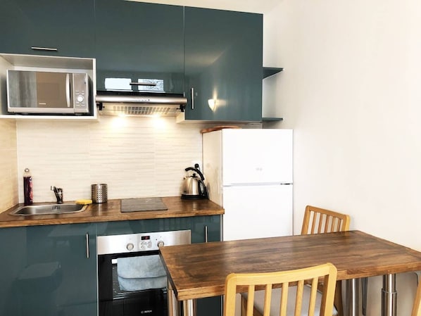 Fridge, microwave, cookware/dishes/utensils