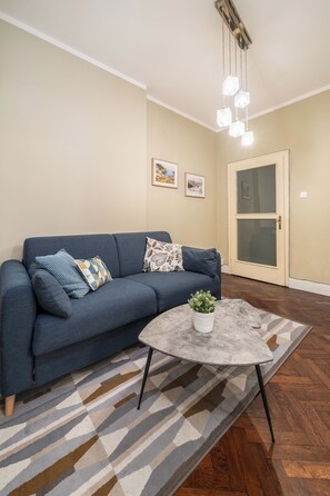 Comfort Apartment, 3 Bedrooms | Living area | Flat-screen TV, fireplace