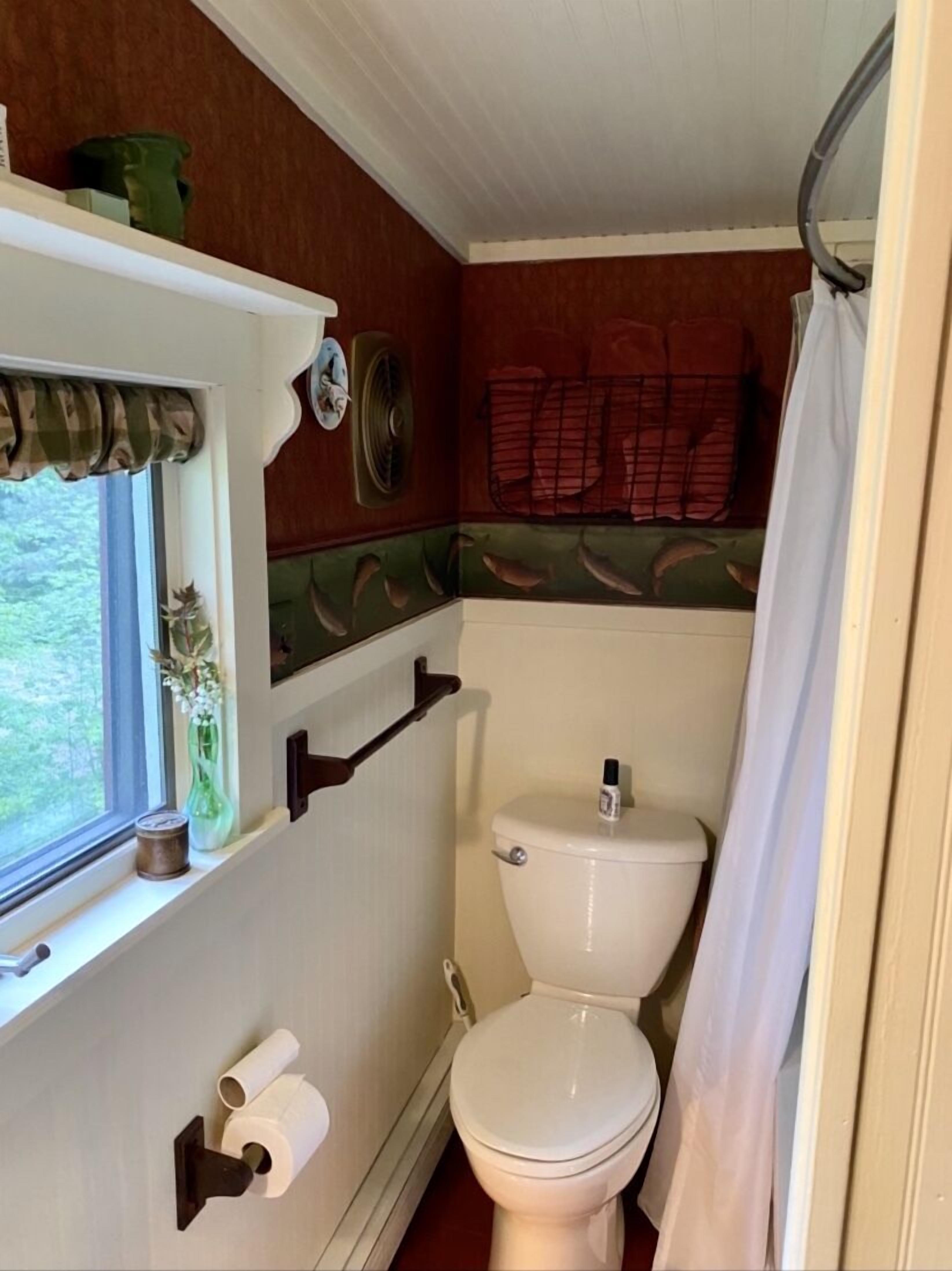 Enchanted Lakeside Cottage Nestled in Perennial Gardens