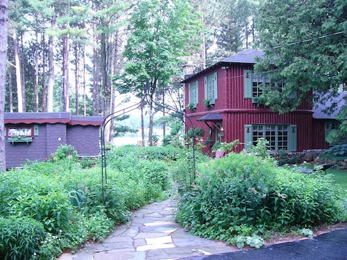 Enchanted Lakeside Cottage Nestled in Perennial Gardens