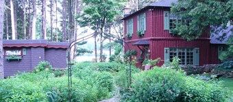 Enchanted Lakeside Cottage Nestled in Perennial Gardens