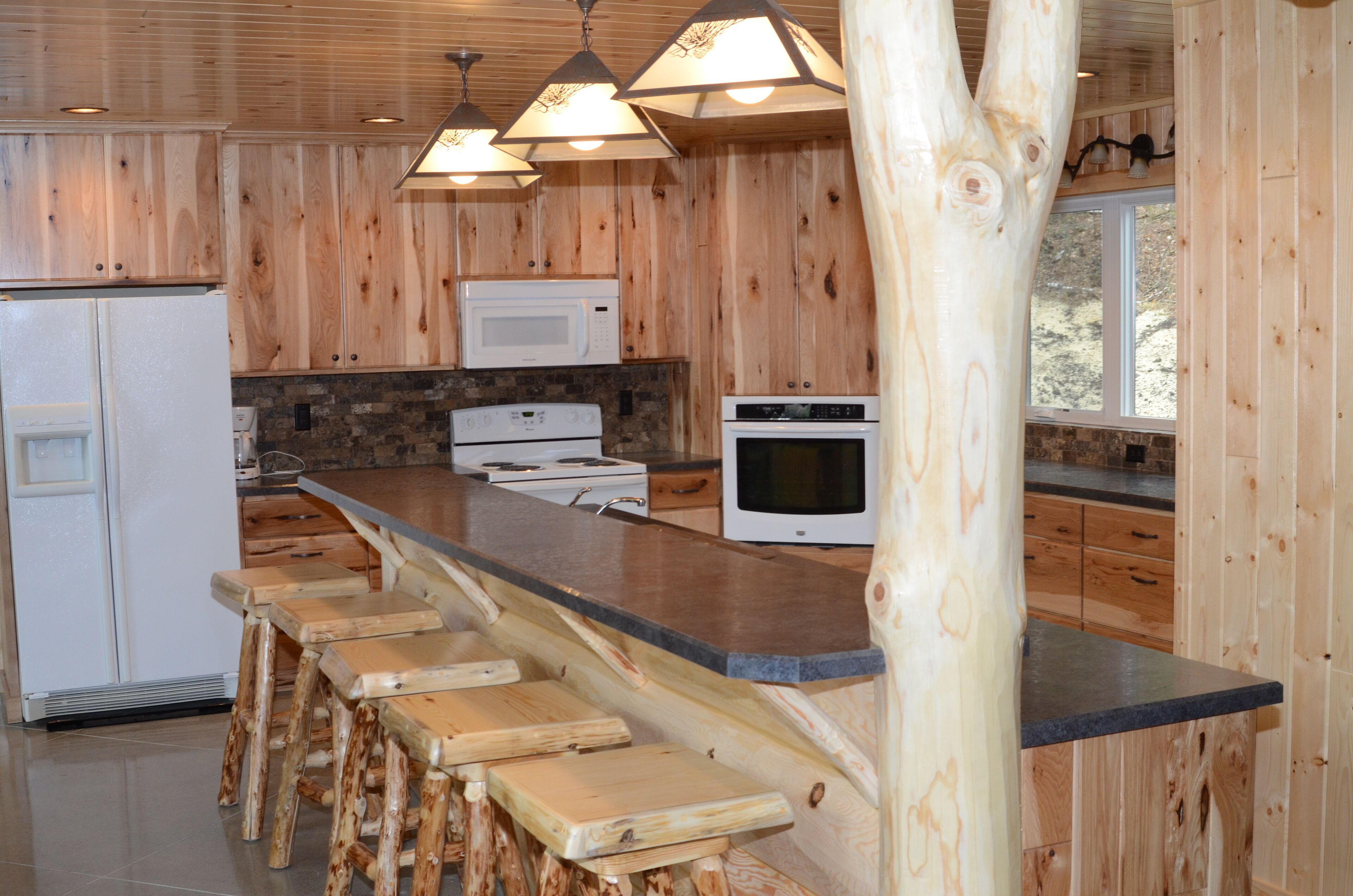 Spruce with two story high windows with loft on the premier lake of Big Sand