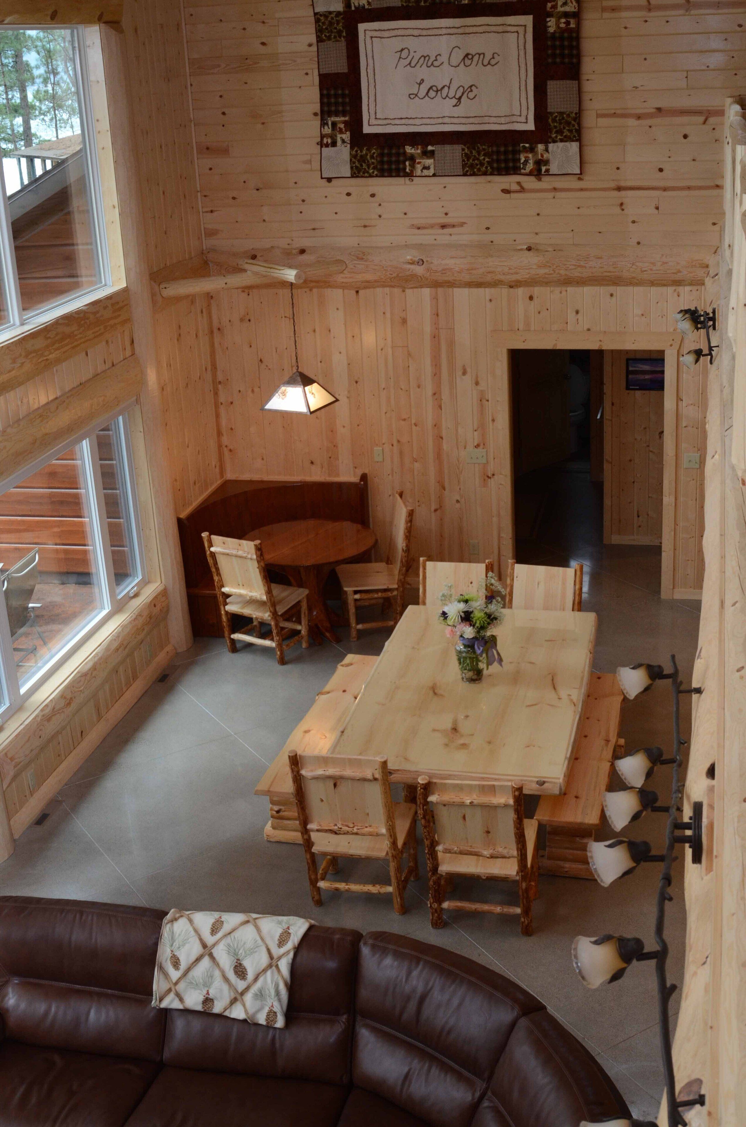 Spruce with two story high windows with loft on the premier lake of Big Sand