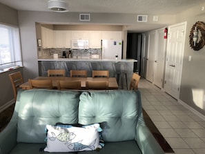 Cozy living space with a dining area, sofa, and kitchenette.