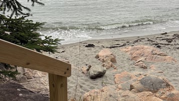 On the beach, sun loungers, beach towels