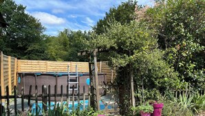 A wooden fence, a stone wall, and a wooden deck. - Nature, Peace and Authenticity... (Montalembert)