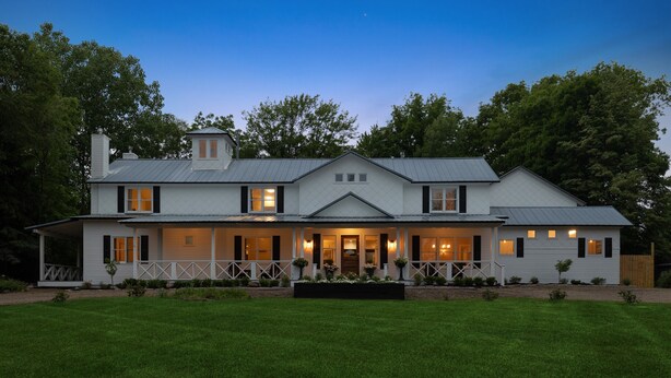A large, two-story house with a covered porch and a well-maintained lawn. - "New" Lake Michigan R & R Recently Completed Major Rehab (Union Pier)