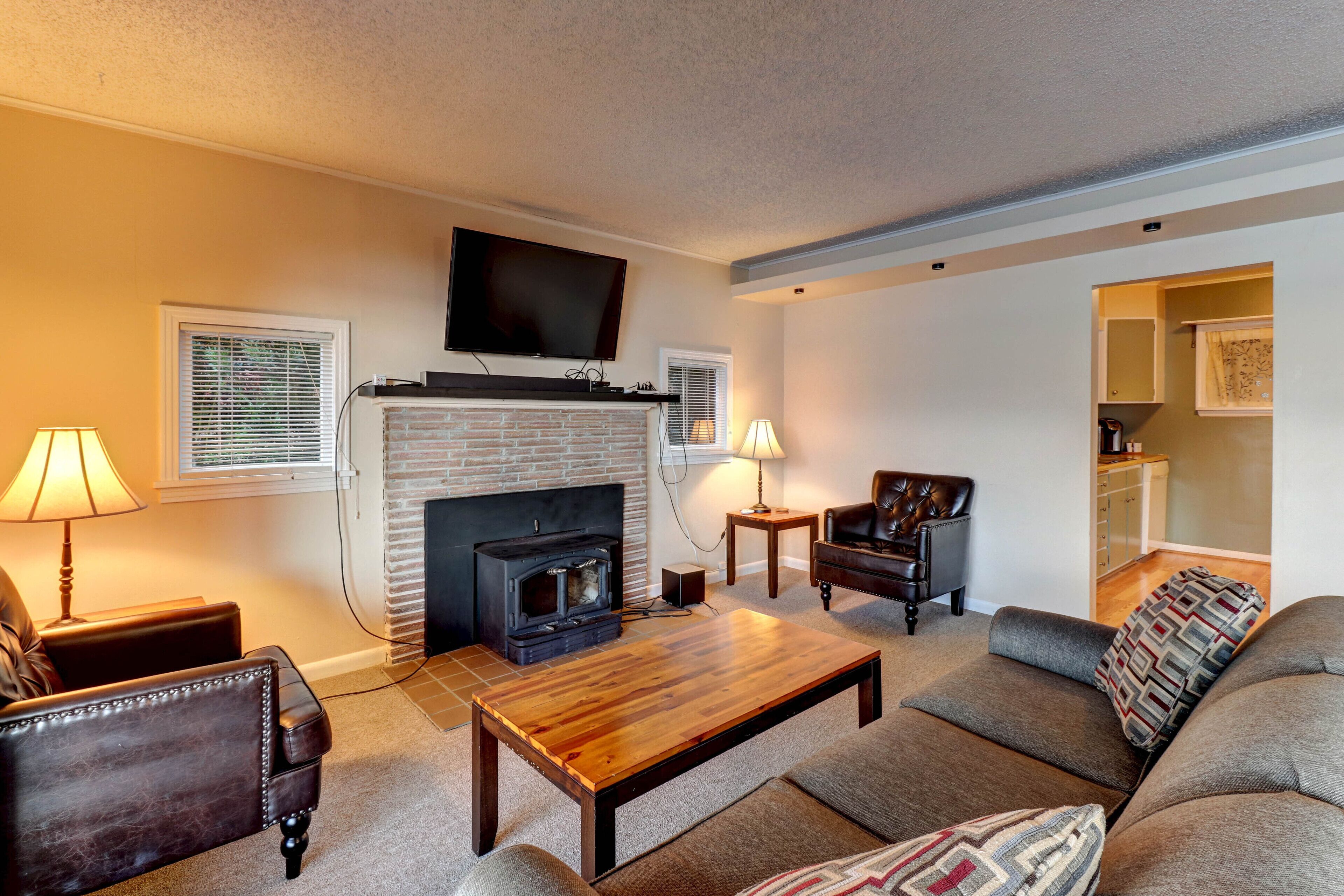 Direct waterfront - welcoming home with fireplace, full kitchen & furnished deck