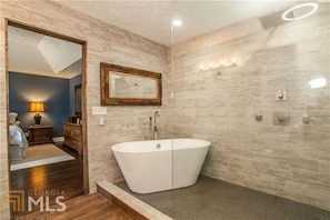 Bathtub, hair dryer, towels, soap