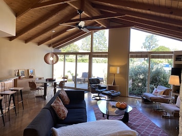 Open floor plan - living room, dining room and kitchen. High ceilings.