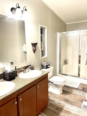 Combined shower/tub, towels, soap, shampoo