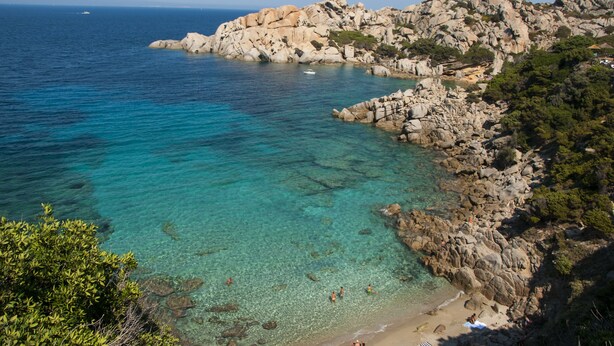 A coastal landscape with clear turquoise waters, rocky cliffs, and a beach area. - One bedroom apartment (4 people) - Residence I Mirti Bianchi (Santa Teresa Gallura)