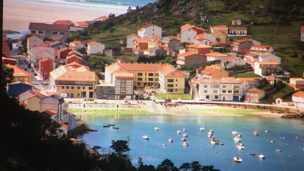 A coastal town with buildings on a hillside and boats on the water. - Apartment/ flat - Coruña (O Pindo)