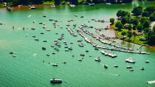 An aerial view of a marina with numerous boats docked in a linear formation. - Large 3 BR 2.5BA Lake Norman House in Birkdale Village,Close to Charlotte! (Huntersville)